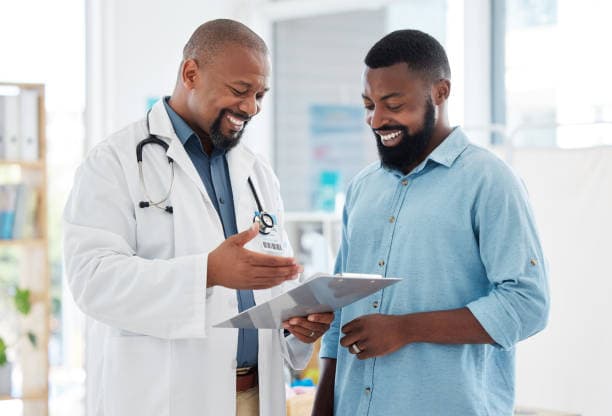 Two persons conversing over a health screening result